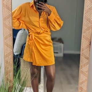 Essie Golden Amazon Drop Wrap mini skirt and dolman sleeve tie front blouse set